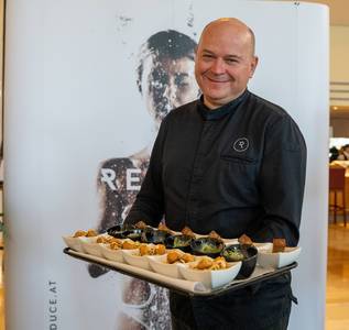 Chef Andras Fuchs with vegan delicacies