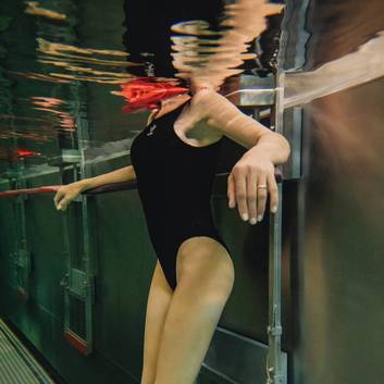 A photo of a woman underwater at the REDUCE.